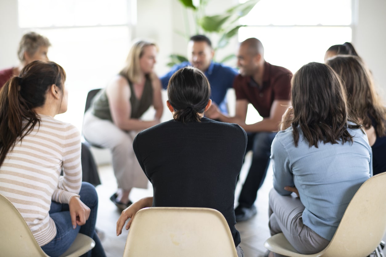 Diverse people in a supporting group session